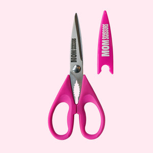 Pink Mom Scissors with protective sheath next to the scissors.